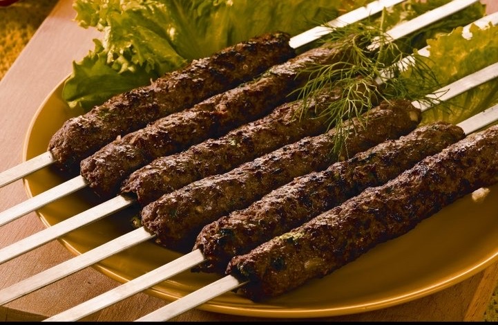 Royal Delight Seekh Kabobs char-grilled on skewers with fresh herbs